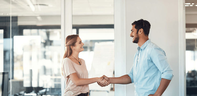 person arriving for an interview and shaking hands